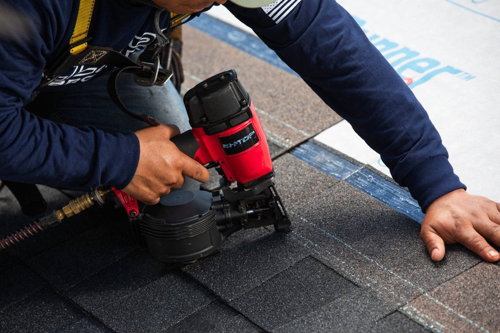Roofing contractor in Metro Atlanta repairing hidden roof damage after a storm