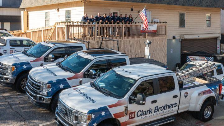 repair team outside of their office in Roswell, GA
