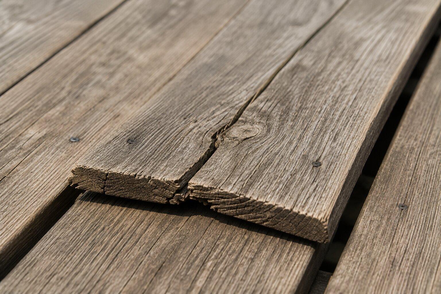 close-up of warped and sun-damaged deck boards