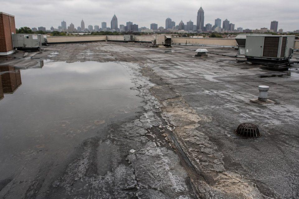 one of the signs you may need a new commercial roof: aging flat roof